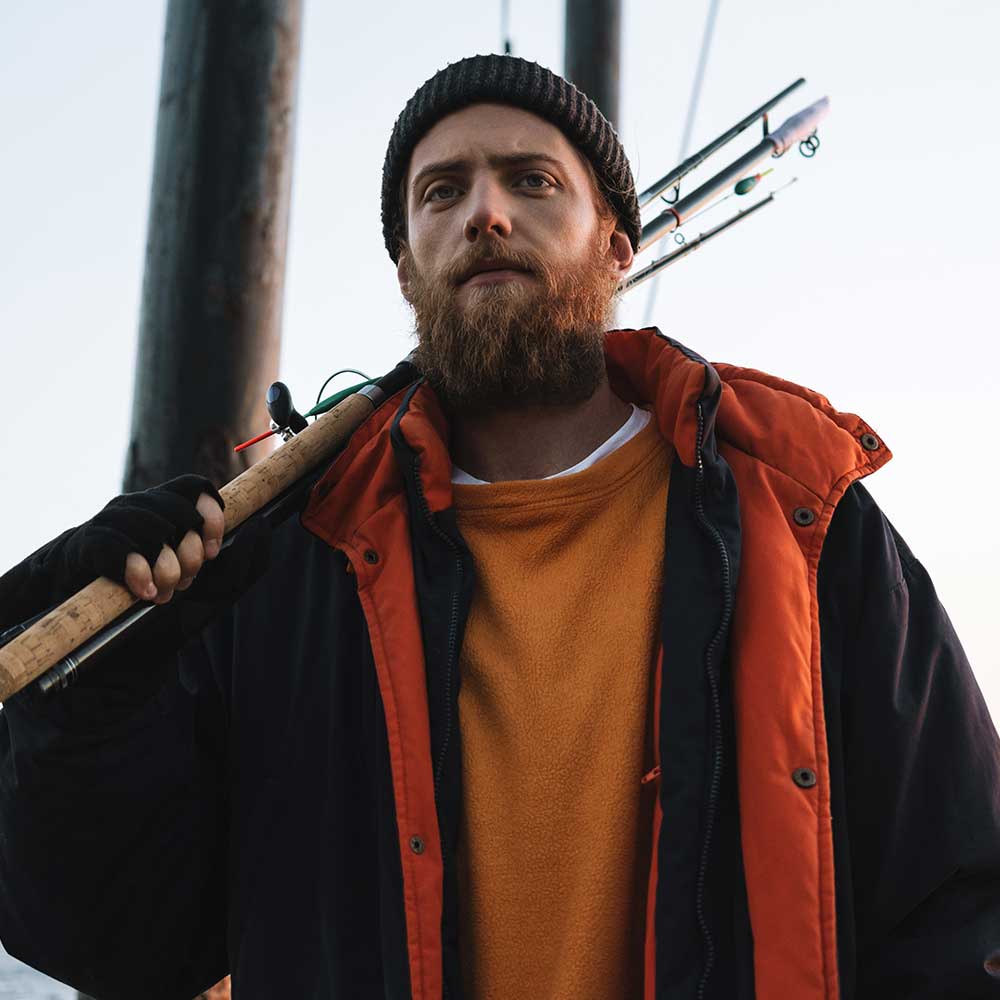 Handsome Brutal Bearded Fisherman Wearing Coat