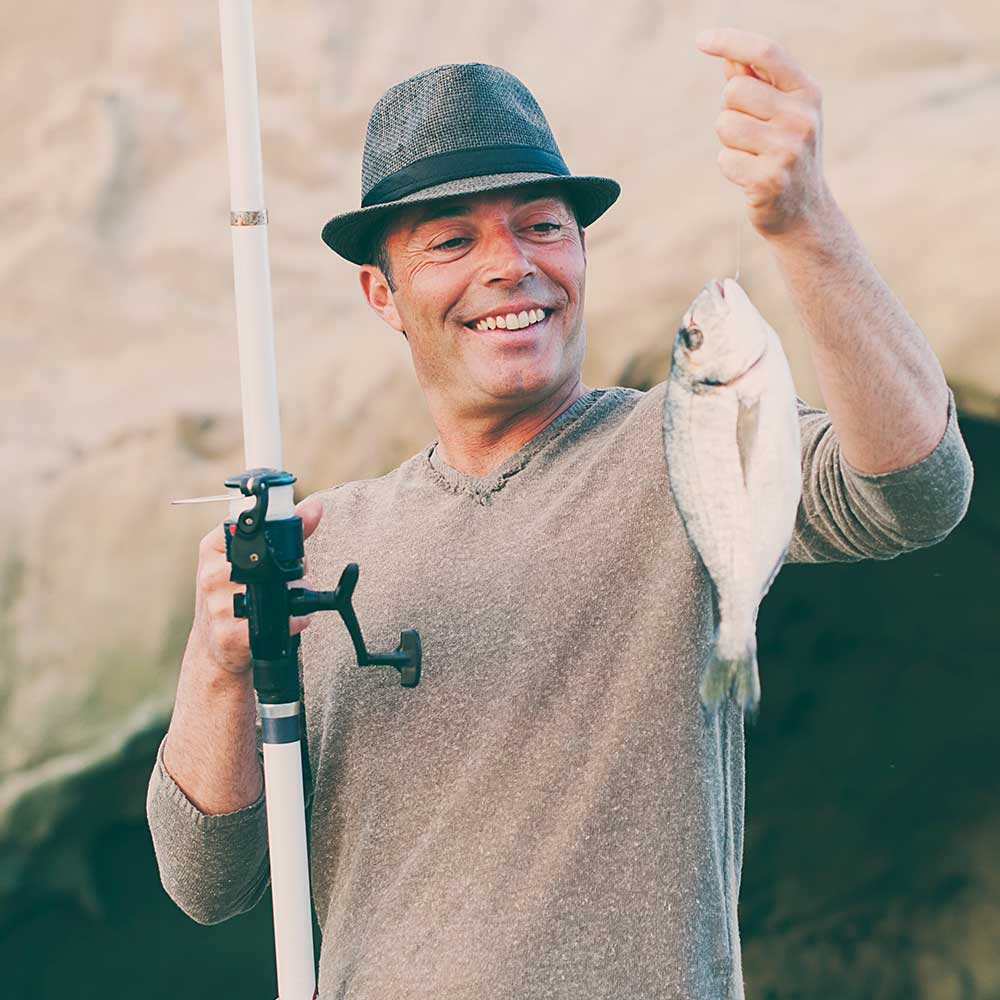 Handsome Man Fishing During His Day Off Sqqudzw