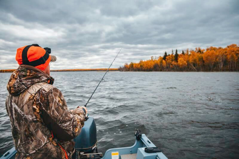 A Man Fishing At The Lake Fishing From A Boat Autumn Season 800x533